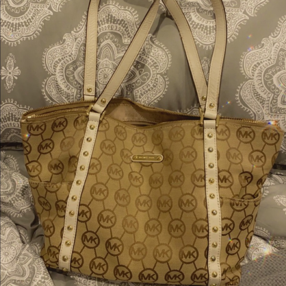 Large Brown Michael Kors Bag with Crossover White straps with gold studs.
